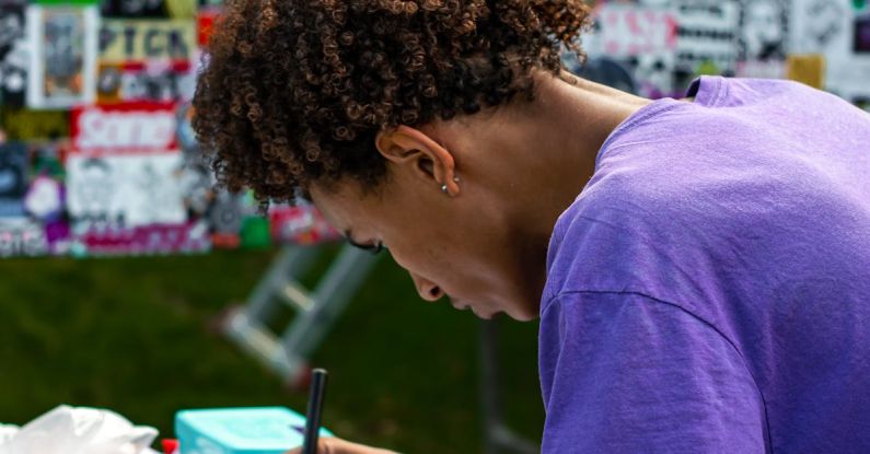 Continuous Learning - A woman writing on a piece of paper