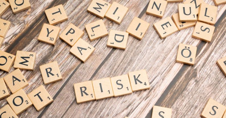 Risk Assessment - Scrabble letters spelling risk on a wooden table