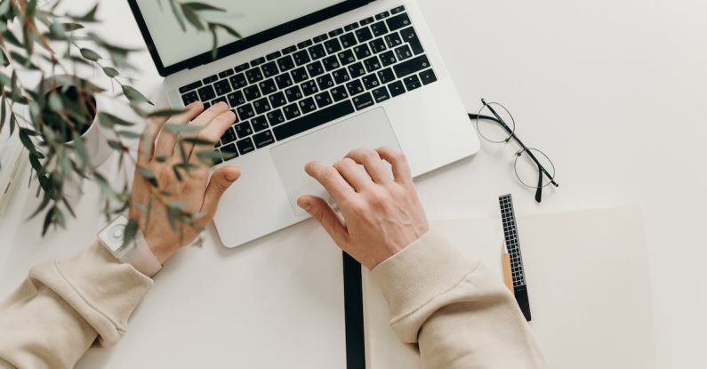 Networking Startup - Person in Beige Long Sleeve Shirt Using Macbook Pro