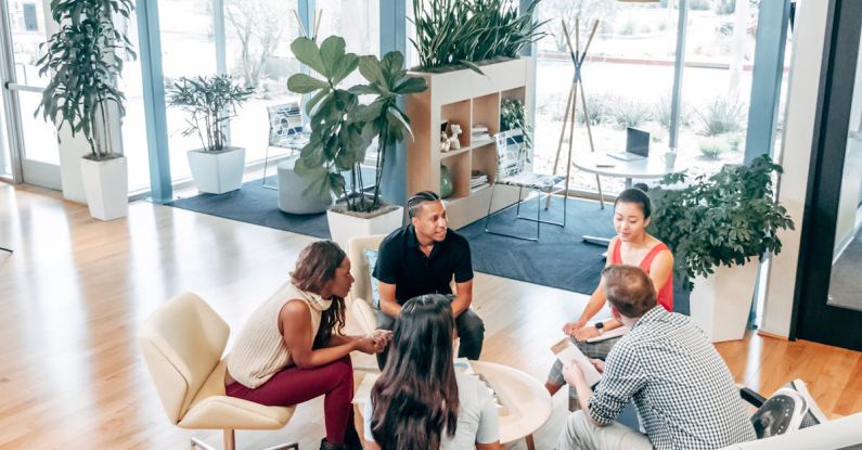 Innovation Success - People Sitting on Chairs Inside Room