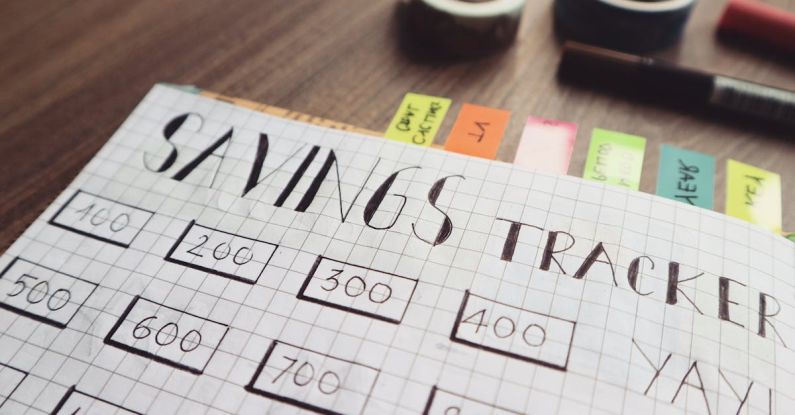 Financial Plan - Savings Tracker on Brown Wooden Surface
