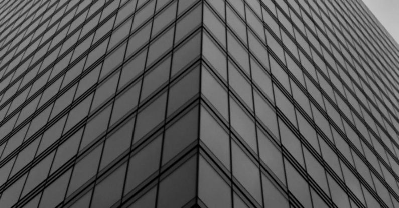 Financial Mistakes - Corner of a Skyscraper with a Glass Facade