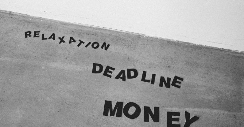 Funding Strategies - Black and white from below background of Relaxation Deadline and Money titles on gray wall