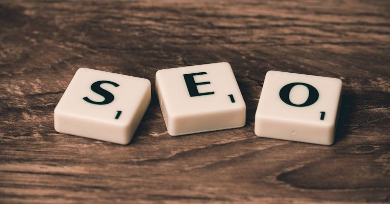 SEO - Three White-and-black Scrabble Tiles on Brown Wooden Surface